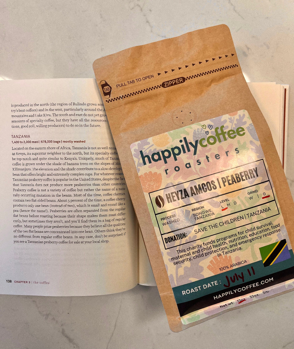 Happily Coffee Roasters package on an open book